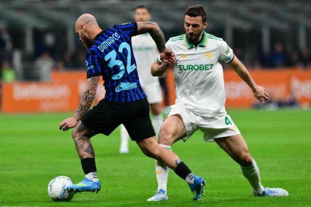 Inter Milan's Italian defender #32 Federico Dimarco fights for the ball with Roma's Italian midfielder #04 Bryan Cristante during the Italian Serie A football match between Inter Milan and AS Roma at San Siro stadium in Milan, on April 5, 2026. (Photo by Stefano RELLANDINI / AFP)