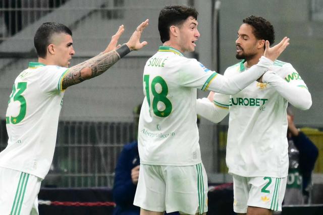 Roma's Italian defender #23 Gianluca Mancini celebrates scoring his team's first goal with Roma's Argentine forward #18 Matias Soule and Roma's Dutch defender #02 Devyne Rensch during the Italian Serie A football match between Inter Milan and AS Roma at San Siro stadium in Milan, on April 5, 2026. (Photo by Stefano RELLANDINI / AFP)
