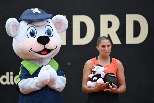 Hungary's Panna Udvardy poses with her trophy next to the event mascot after losing to Czech Republic's Marie Bouzkova in the WTA Bogota women's singles final match at the Country Club in Bogota on April 5, 2026. (Photo by RAUL ARBOLEDA / AFP)