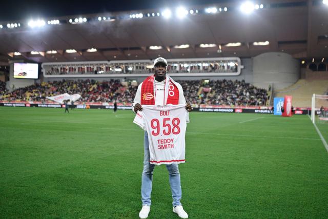 Jamaican former sprinter Usain Bolt poses with a jersey prior to the kick off of the French L1 football match between Monaco (ASM) and Olympique de Marseille (OM) at the Louis II Stadium in Monaco on April 5, 2026. (Photo by Frederic DIDES / AFP)