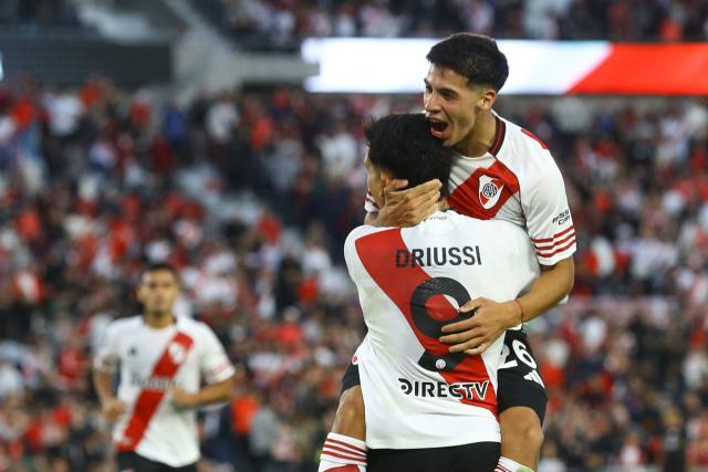River Plate midfielder #26 Tomas Galvan (R) celebrates after scoring the first goal during the Argentine Professional Football League 2026 Apertura Tournament match between River Plate and Belgrano at MAS Monumental stadium in Buenos Aires on April 5, 2026. (Photo by ALEJANDRO PAGNI / AFP)