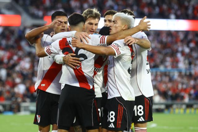River Plate midfielder #26 Tomas Galvan (C) celebrates with teammates after scoring the first goal during the Argentine Professional Football League 2026 Apertura Tournament match between River Plate and Belgrano at MAS Monumental stadium in Buenos Aires on April 5, 2026. (Photo by ALEJANDRO PAGNI / AFP)