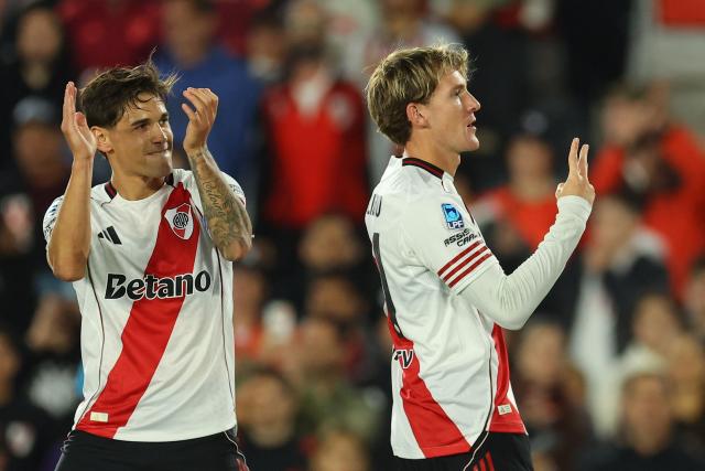 River Plate's forward #11 Facundo Collidio (R) celebrates scoring his team's second goal during the Argentine Professional Football League 2026 Apertura Tournament match between River Plate and Belgrano at MAS Monumental stadium in Buenos Aires on April 5, 2026. (Photo by ALEJANDRO PAGNI / AFP)