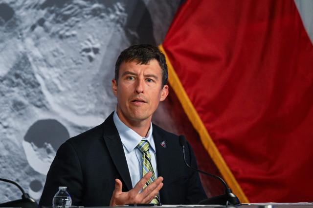NASA flight director Rick Henfling speaks during a status briefing of the Artemis II crewed lunar mission at Johnson Space Center in Houston, Texas, on April 5, 2026. The four astronauts on NASA's Artemis 2 mission prepared April 5 to enter the Moon's "sphere of influence," having already taking in sights of the lunar surface never before seen by human eyes. As they awoke for day five of the 10-day mission, their Orion spaceship was nearly 215,000 miles (346,000 kilometers) from Earth and 65,000 miles from the Moon, according to NASA's online dashboard. (Photo by RONALDO SCHEMIDT / AFP)