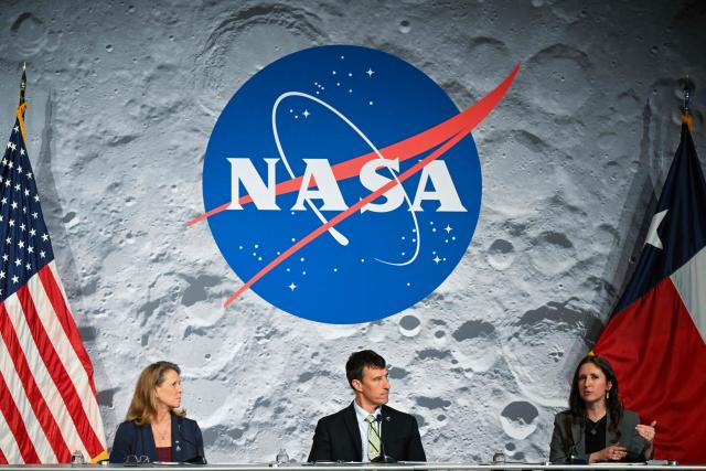 Lori Glaze (L), acting associate administrator for NASAs Exploration Systems Development Mission Directorate and NASA flight director Rick Henfling (C) listen to Kelsey Young (R) Artemis II lunar science lead speak during a status briefing of the Artemis II crewed lunar mission at Johnson Space Center in Houston, Texas, on April 5, 2026. The four astronauts on NASA's Artemis 2 mission prepared April 5 to enter the Moon's "sphere of influence," having already taking in sights of the lunar surface never before seen by human eyes. As they awoke for day five of the 10-day mission, their Orion spaceship was nearly 215,000 miles (346,000 kilometers) from Earth and 65,000 miles from the Moon, according to NASA's online dashboard. (Photo by RONALDO SCHEMIDT / AFP)