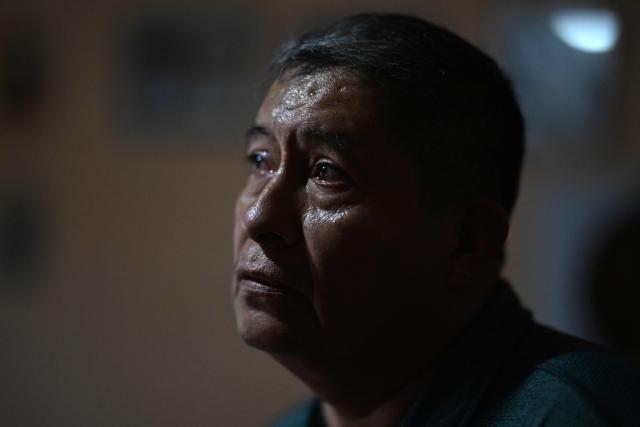 Reynaldo Santos, 58, father of Jonathan Santos, who was previously detained and is now being processed under the state of exception, looks on during an interview with AFP at his home in Soyapango, El Salvador, on March 9, 2026. Mass trials in El Salvador are moving forward against some 91,000 people detained under the state of exception imposed by President Nayib Bukele four years ago, in his anti-gang "war." (Photo by AFP)
