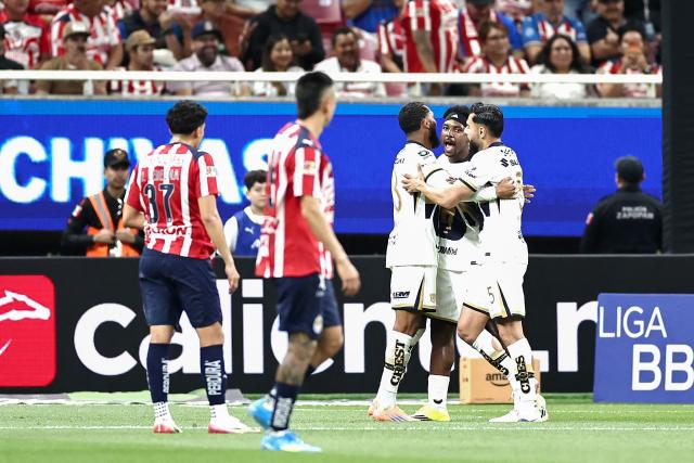 Pumas' Colombian defender #77 Alvaro Angulo (2nd-R) celebrates with teammates after scoring his team's second goal during the Liga MX Clausura football match between Guadalajara and Pumas at Akron stadium in Zapopan, Jalisco state, Mexico, on April 5, 2026. (Photo by Ulises Ruiz / AFP)