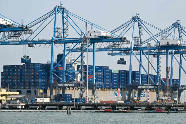A cargo ship is docked at Malaysia's North Klang port in Port Klang, on the outskirts of Kuala Lumpur on April 6, 2026. (Photo by Mohd RASFAN / AFP)