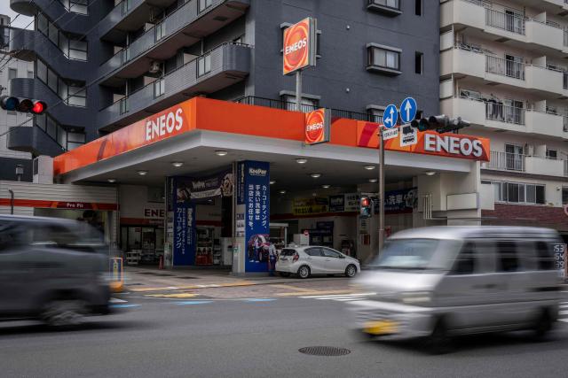 Motorists drive past a gas station in Kawasaki, Kanagawa prefecture on April 6, 2026. (Photo by Yuichi YAMAZAKI / AFP)
