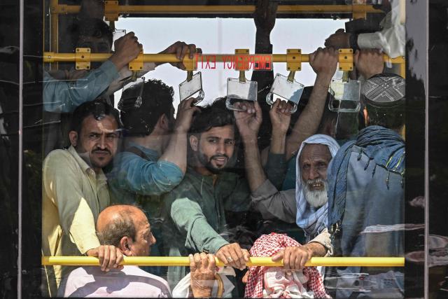 Commuters travel on a free state-run public bus in Islamabad on April 6, 2026. State-run public transport in Pakistan's capital and most populous province will be free for the coming month, officials said on April 3, after the government drastically raised fuel prices due to the Iran war. (Photo by Aamir QURESHI / AFP)