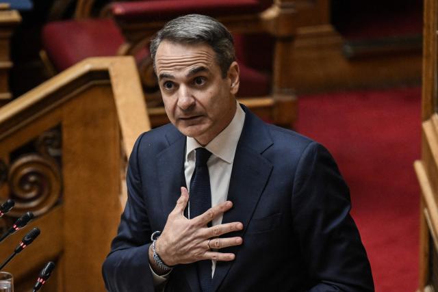 (FILES) Greek Prime Minister Kyriakos Mitsotakis addresses lawmakers at parliament, ahead of a vote on confidence following a motion of censure submitted by leftist and centre-left opposition parties, in Athens on March 28, 2024. Greek Prime Minister Kyriakos Mitsotakis on April 6, 2026 asked the European public prosecutor's office to launch "without delay" proceedings against lawmakers suspected to be involved in alleged fraud related to EU agricultural subsidies. "I am asking the European Public Prosecutor's Office, once the immunity of our MPs has been lifted, to immediately take all investigative measures," he said in a statement broadcast on public television, specifying that it would have to "rule on whether, against how many, and against which individuals it intends to bring charges." (Photo by Aris MESSINIS / AFP)