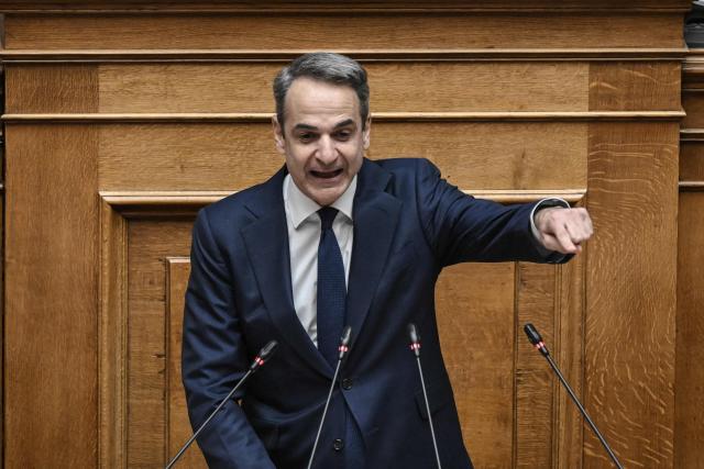 (FILES) Greek Prime Minister Kyriakos Mitsotakis addresses lawmakers at parliament, ahead of a vote on confidence, following a censure motion submitted by Leftist and Centre-Left opposition parties, in Athens on March 28, 2024. Greek Prime Minister Kyriakos Mitsotakis on April 6, 2026 asked the European public prosecutor's office to launch "without delay" proceedings against lawmakers suspected to be involved in alleged fraud related to EU agricultural subsidies. "I am asking the European Public Prosecutor's Office, once the immunity of our MPs has been lifted, to immediately take all investigative measures," he said in a statement broadcast on public television, specifying that it would have to "rule on whether, against how many, and against which individuals it intends to bring charges." (Photo by Aris MESSINIS / AFP)