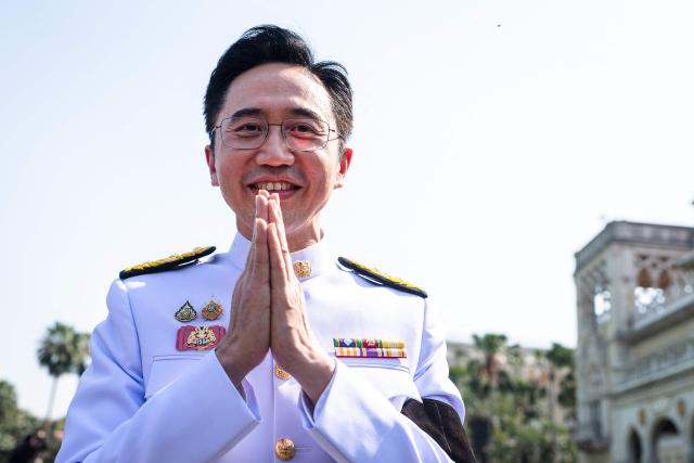 Thailand's incoming Minister of Higher Education, Science, Research and Innovation and member of the Pheu Thai Party Yodchanan Wongsawat gestures before being sworn in to office at Government House in Bangkok on April 6, 2026. (Photo by Chanakarn LAOSARAKHAM / AFP)