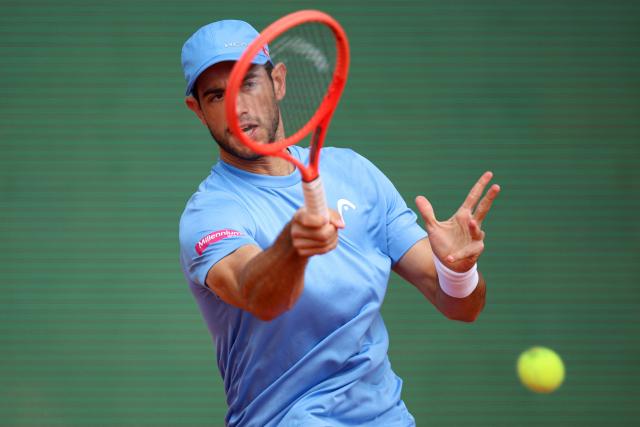Portugal's Nuno Borges plays a forehand return to Russia's Andrey Rublev during the Monte Carlo ATP Masters Series Tournament round of 64 tennis match on Court Rainier III at the Monte-Carlo Country Club in Roquebrune-Cap-Martin, south-eastern France on April 6, 2026. (Photo by Valery HACHE / AFP)