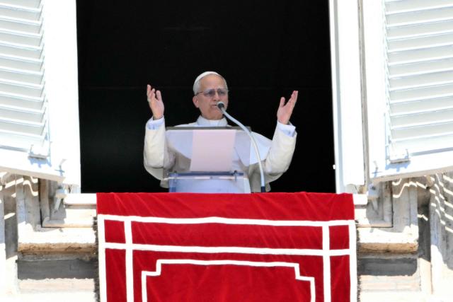 Pope Leo XIV addresses the crowd from the window of the apostolic palace overlooking St. Peter's square during the Regina Coeli prayer in The Vatican on April 6, 2026. (Photo by Alberto PIZZOLI / AFP)