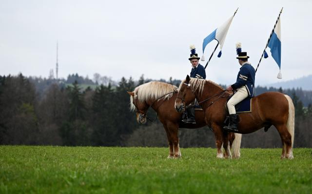 Participants in historical costumes and on horseback are seen during the traditional St George's Cavalcade (Georgiritt) in Traunstein, southern Germany on Easter Monday on April 6, 2026. The annual ride is a horse pilgrimage to honor Saint George and takes the participants from the Bavarian town of Traunstein to the chapel of Ettendorf, where they are blessed. (Photo by Christof STACHE / AFP)