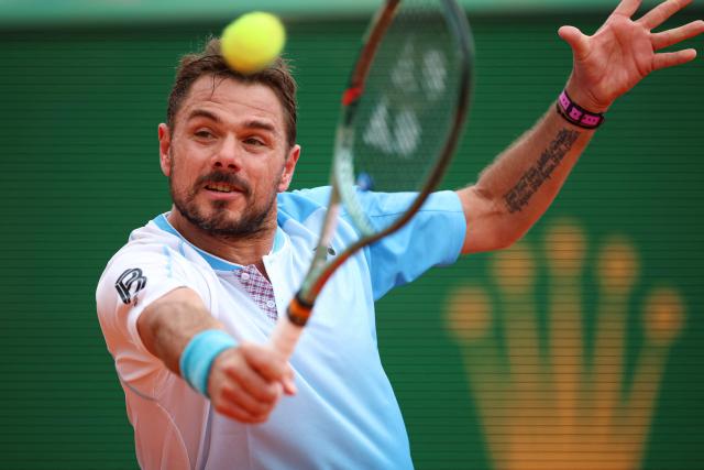 Switzerland's Stanislas Wawrinka plays a backhand return to Argentinia's Sebastian Baez during the Monte Carlo ATP Masters Series Tournament round of 64 tennis match on Court Rainier III at the Monte-Carlo Country Club in Roquebrune-Cap-Martin, south-eastern France on April 6, 2026. (Photo by Valery HACHE / AFP)