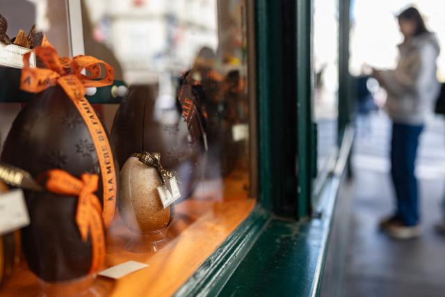 Chocolate Easter eggs adorn a "confiserie" shop window, on Easter Monday in Paris on April 6, 2026. (Photo by Ian LANGSDON / AFP)