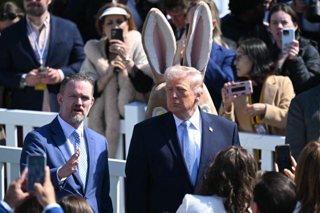 US President Donald Trump speaks with US Trade Representative Jamieson Greer during the annual Easter Egg Roll on the South Lawn of the White House on April 6, 2026, in Washington, DC. (Photo by SAUL LOEB / AFP)