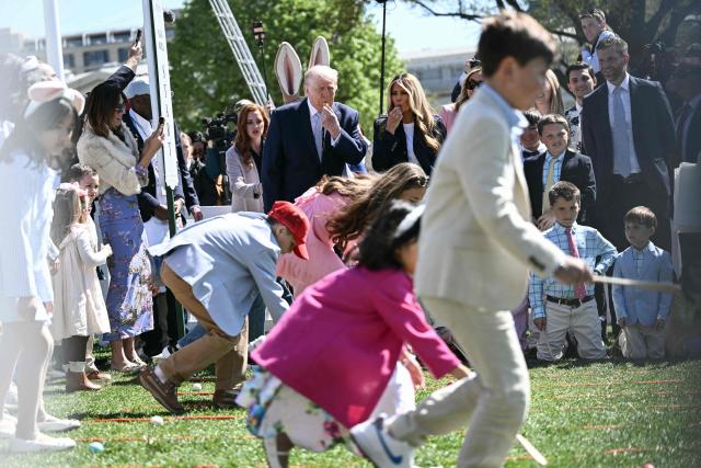US President Donald Trump and First Lady Melania Trump blow whistles as children participate in the annual Easter Egg Roll on the South Lawn of the White House on April 6, 2026, in Washington, DC. (Photo by Brendan SMIALOWSKI / AFP)