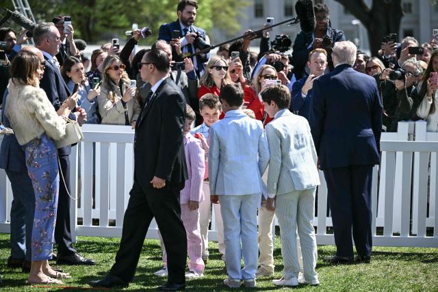 US President Donald Trump (R) speaks to reporters as he hosts the annual Easter Egg Roll on the South Lawn of the White House on April 6, 2026, in Washington, DC. (Photo by Brendan SMIALOWSKI / AFP)