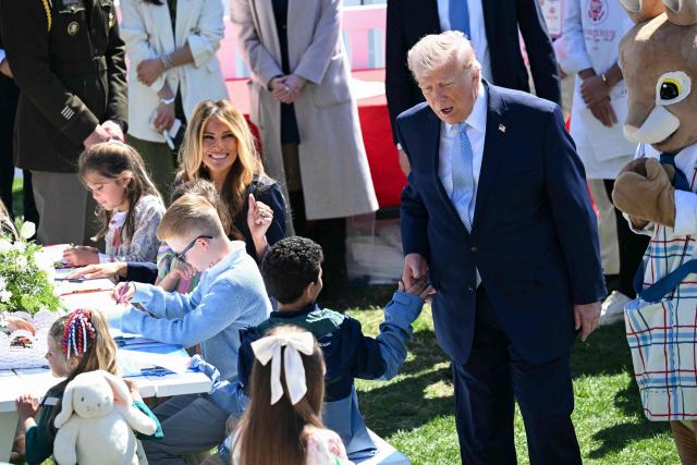 US President Donald Trump and First Lady Melania Trump greet children during the annual Easter Egg Roll on the South Lawn of the White House on April 6, 2026, in Washington, DC. (Photo by SAUL LOEB / AFP)