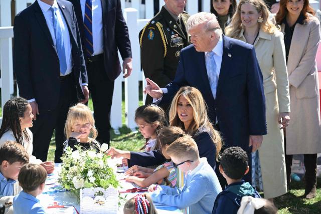 US President Donald Trump and First Lady participate in a coloring activity with children as he hosts the annual Easter Egg Roll on the South Lawn of the White House on April 6, 2026, in Washington, DC. (Photo by SAUL LOEB / AFP)