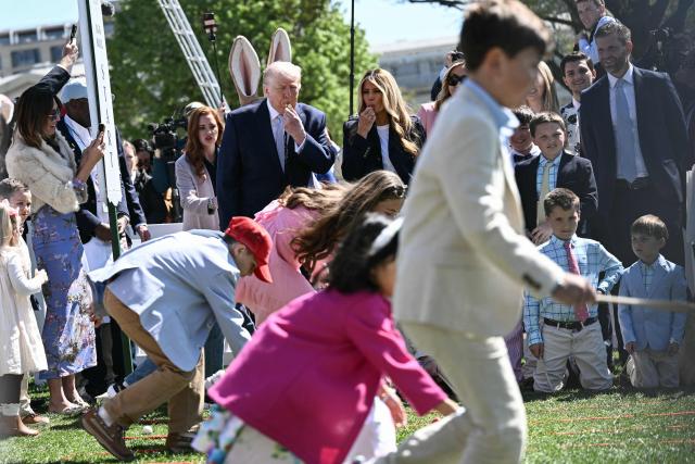 US President Donald Trump and First Lady Melania Trump blow whistles as children participate in the annual Easter Egg Roll on the South Lawn of the White House on April 6, 2026, in Washington, DC. (Photo by Brendan SMIALOWSKI / AFP)