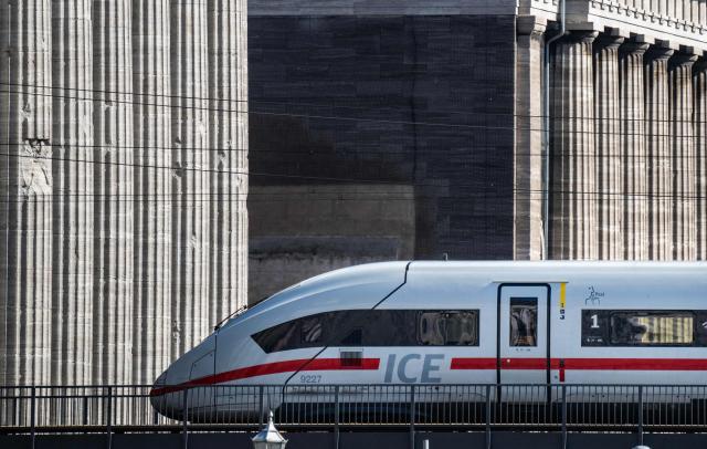 An engine of an ICE (Inter-City Express) train of the Deutsche Bahn travels past the facade of Berlin's Pergamon Museum on April 6, 2026. (Photo by John MACDOUGALL / AFP)