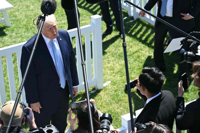 US President Donald Trump speaks to members of the media as he hosts the annual Easter Egg Roll on the South Lawn of the White House on April 6, 2026, in Washington, DC. (Photo by SAUL LOEB / AFP)