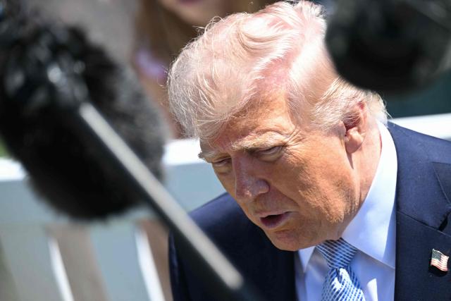 US President Donald Trump speaks to members of the media as he hosts the annual Easter Egg Roll on the South Lawn of the White House on April 6, 2026, in Washington, DC. (Photo by SAUL LOEB / AFP)