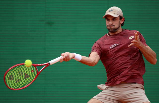 Monaco's Valentin Vacherot plays a forehand return to Argentinia's Juan Manuel Cerundolo during the Monte Carlo ATP Masters Series Tournament round of 64 tennis match on Court Rainier III at the Monte-Carlo Country Club in Roquebrune-Cap-Martin, south-eastern France on April 6, 2026. (Photo by Valery HACHE / AFP)