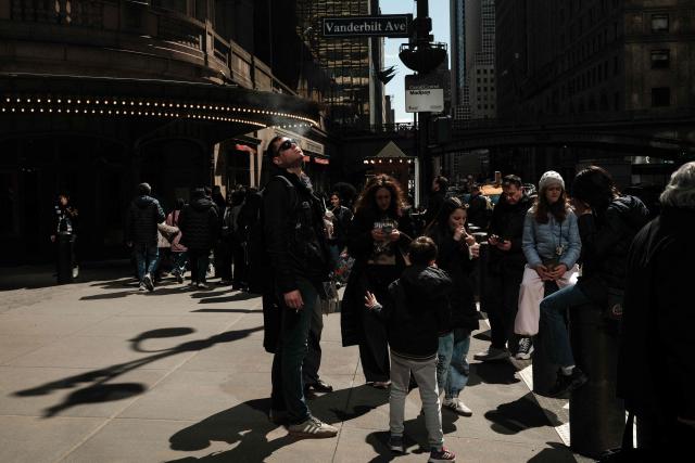 A man smokes a cigarette as he stands in a street of the Manhattan borough of New York City on April 6, 2026. (Photo by CHARLY TRIBALLEAU / AFP)