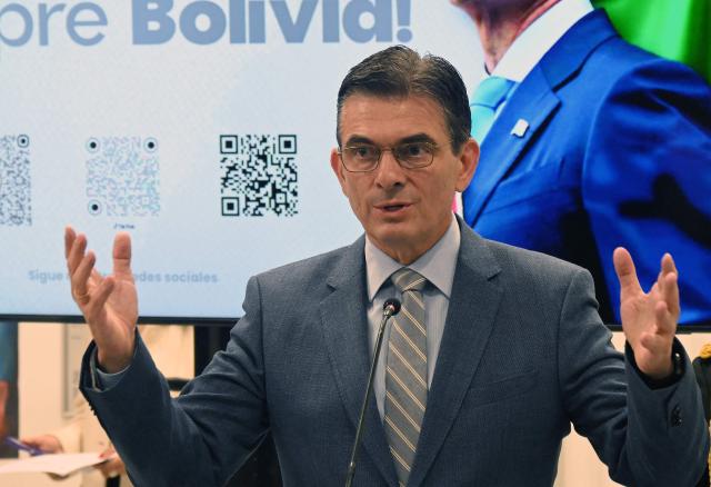 Bolivia's President Rodrigo Paz speaks during a press conference after the government revoked decrees on direct contracting and the awarding of public works contracts, at the Casa Grande del Pueblo, the seat of the Government Palace, on April 6, 2026, (Photo by Aizar RALDES / AFP)