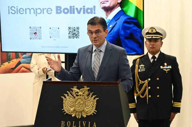 Bolivia's President Rodrigo Paz speaks during a press conference after the government revoked decrees on direct contracting and the awarding of public works contracts, at the Casa Grande del Pueblo, the seat of the Government Palace, on April 6, 2026, (Photo by Aizar RALDES / AFP)