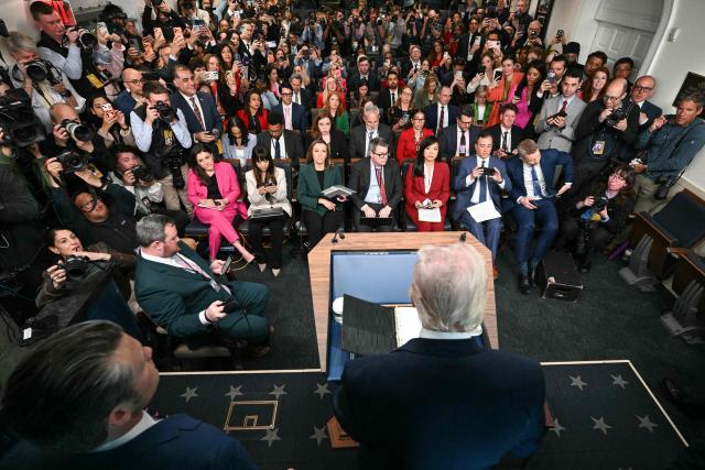US President Donald Trump and US Secretary of Defense Pete Hegseth (L) arrive to speak about the conflict in Iran in the James S. Brady Press Briefing Room of the White House on April 6, 2026, in Washington, DC. (Photo by Brendan SMIALOWSKI / AFP)