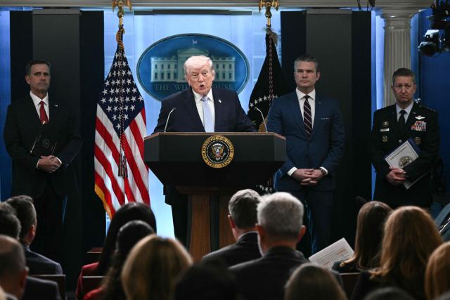 US President Donald Trump, alongside CIA Director John Ratcliffe (L), US Secretary of Defense Pete Hegseth (2R) and Chairman of the Joint Chiefs of Staff General Dan Caine (R), speaks about the conflict in Iran in the James S. Brady Press Briefing Room of the White House on April 6, 2026, in Washington, DC. (Photo by Brendan SMIALOWSKI / AFP)