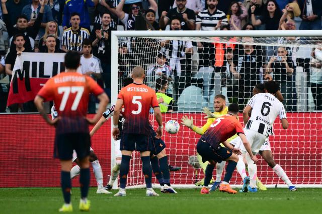 Juventus' Italian goalkeeper #16 Michele Di Gregorio makes a save after a penalty during the Italian Serie A football match between Juventus and Genoa at the Allianz stadium in Turin, on April 6, 2026. (Photo by Marco BERTORELLO / AFP)