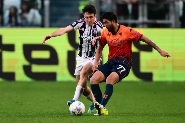Juventus' Italian defender #27 Andrea Cambiaso fights for the ball with Genoa's Icelandic forward #77 Mikael Egill Ellertsson during the Italian Serie A football match between Juventus and Genoa at the Allianz stadium in Turin, on April 6, 2026. (Photo by Marco BERTORELLO / AFP)