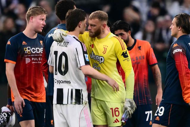 Juventus' Italian goalkeeper #16 Michele Di Gregorio hugs Juventus' Turkish forward #10 Kenan Yildiz at the end of the Italian Serie A football match between Juventus and Genoa at the Allianz stadium in Turin, on April 6, 2026. (Photo by Marco BERTORELLO / AFP)