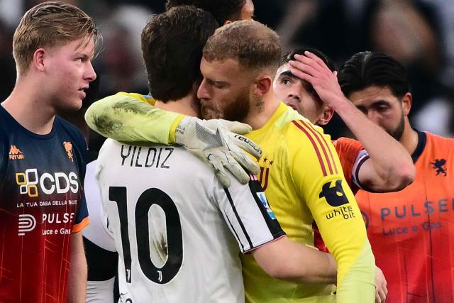 Juventus' Italian goalkeeper #16 Michele Di Gregorio hugs Juventus' Turkish forward #10 Kenan Yildiz at the end of the Italian Serie A football match between Juventus and Genoa at the Allianz stadium in Turin, on April 6, 2026. (Photo by Marco BERTORELLO / AFP)