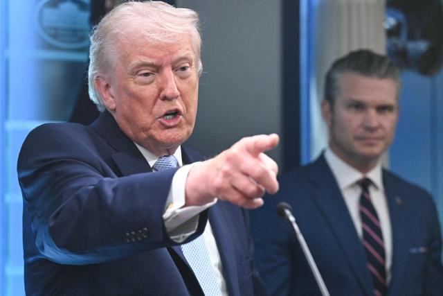 US President Donald Trump, alongside Secretary of Defense Pete Hegseth, speaks about the conflict in Iran in the James S. Brady Press Briefing Room of the White House on April 6, 2026, in Washington, DC. (Photo by SAUL LOEB / AFP)