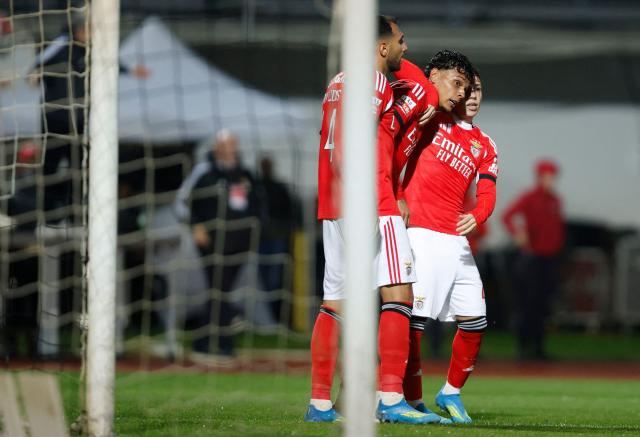 SL Benfica's Colombian midfielder #20 Richard Rios (C) celebrates scoring the opening goal during the Portuguese League football match between Casa Pia AC and SL Benfica at Rio Maior Municipal Stadium on April 6, 2026. (Photo by FILIPE AMORIM / AFP)