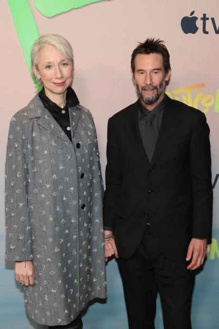 Alexandra Grant and Canadian actor Keanu Reeves attend the premiere of Apple's "Outcome" in New York City on April 6, 2026. (Photo by ANGELA WEISS / AFP)