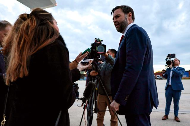 US Vice President JD Vance speaks with reporters prior to boarding Air Force Two while departing for Budapest, Hungary from Joint Base Andrews, Maryland, on April 6, 2026. Vance is set to visit Budapest on Tuesday and hold a rally with Hungarian Prime Minister Viktor Orban. (Photo by Jonathan Ernst / POOL / AFP)