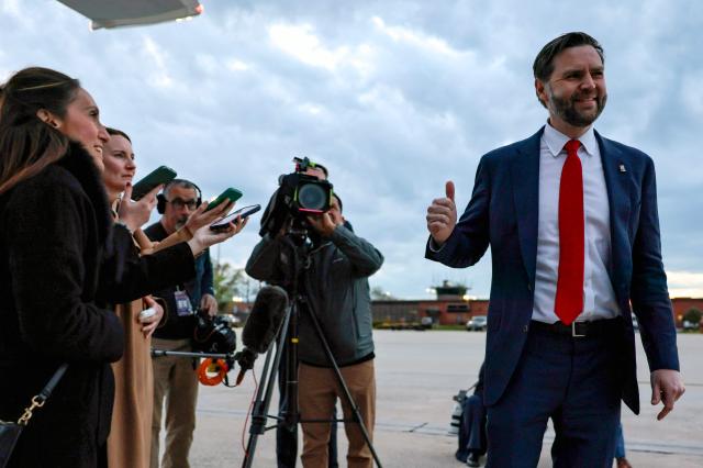 US Vice President JD Vance flashes a thumbs up prior to boarding Air Force Two while departing for Budapest, Hungary from Joint Base Andrews, Maryland, on April 6, 2026. Vance is set to visit Budapest on Tuesday and hold a rally with Hungarian Prime Minister Viktor Orban. (Photo by Jonathan Ernst / POOL / AFP)
