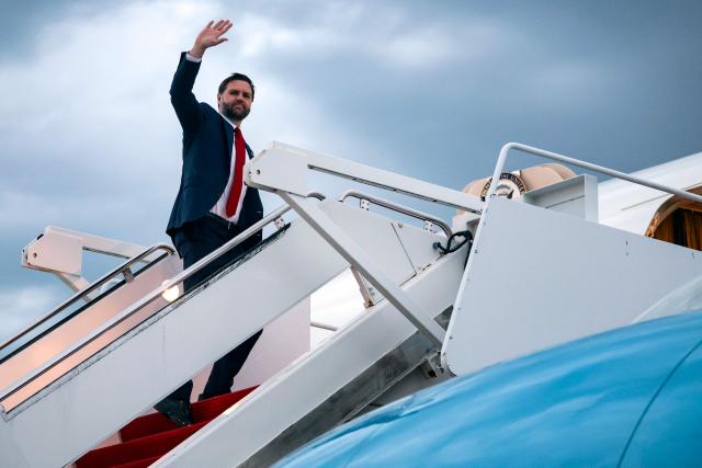 US Vice President JD Vance waves as he boards Air Force Two to depart for Budapest, Hungary from Joint Base Andrews, Maryland, on April 6, 2026. Vance is set to visit Budapest on Tuesday and hold a rally with Hungarian Prime Minister Viktor Orban. (Photo by Jonathan Ernst / POOL / AFP)