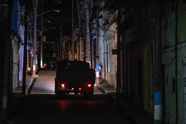 A truck drives along a dark street during a blackout in Matanzas, Cuba, on April 6, 2026. Matanzas is one of the Cuban cities most affected by electricity shortages, at times going more than 24 hours without power, despite being home to the Antonio Guiteras Thermoelectric Plant, one of the country’s most important. (Photo by AFP)