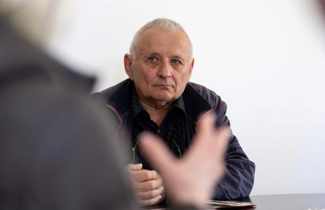 Juraj Pievac (70) speaks to a journalist at his house near the place where he was injured by a mine explosion in the village of Brodani near Karlovac on March 24, 2026. More than 30 years after the independence war, that left behind around 107,000 landmines and 470,000 unexploded ordnances, Croatia is declared mine-free, a historic milestone for the country. (Photo by MARKO PERKOV / AFP)