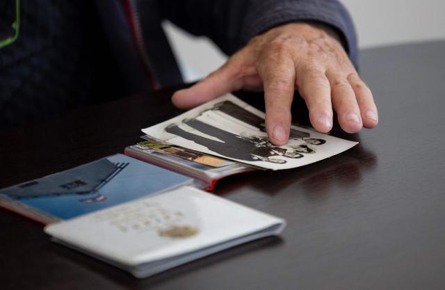 Juraj Pievac (70) shows an old photo from his wedding remembering his wife, who was killed in a landmine explosion in the village of Brodani near Karlovac on March 24, 2026. More than 30 years after the independence war, that left behind around 107,000 landmines and 470,000 unexploded ordnances, Croatia is declared mine-free, a historic milestone for the country. (Photo by MARKO PERKOV / AFP)